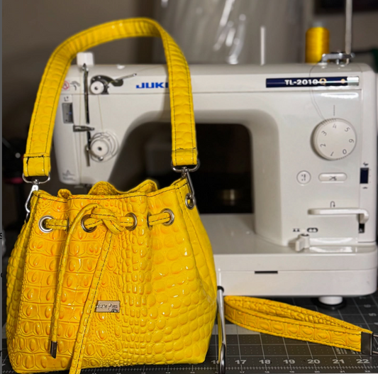 Mini drawstring bucket bag with crossbody strap — Kouture Yves